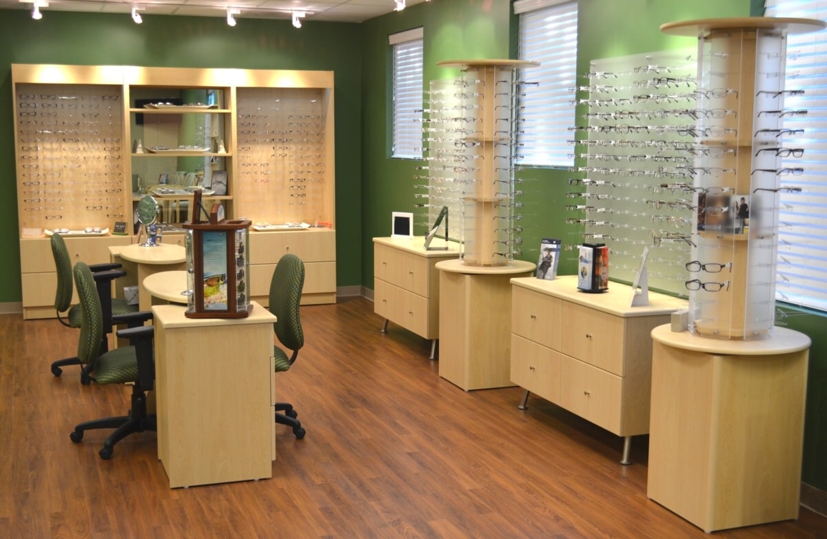 Dispensing Desks, Tall Cabinets with "One way mirror" back, frame display boards, matching storage credenza's, and rotary displays. Affordable optical displays cabinetry.