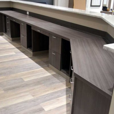 Multi-Station reception desk with file drawers, pencil drawers, and computer tower cubbies with vents. Commercial grade laminate