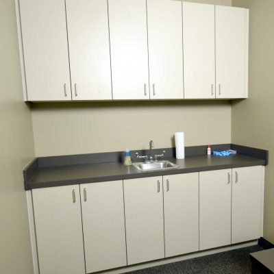 Laminate sink base and storage for Contact Lens Training room. Durable commercial quality